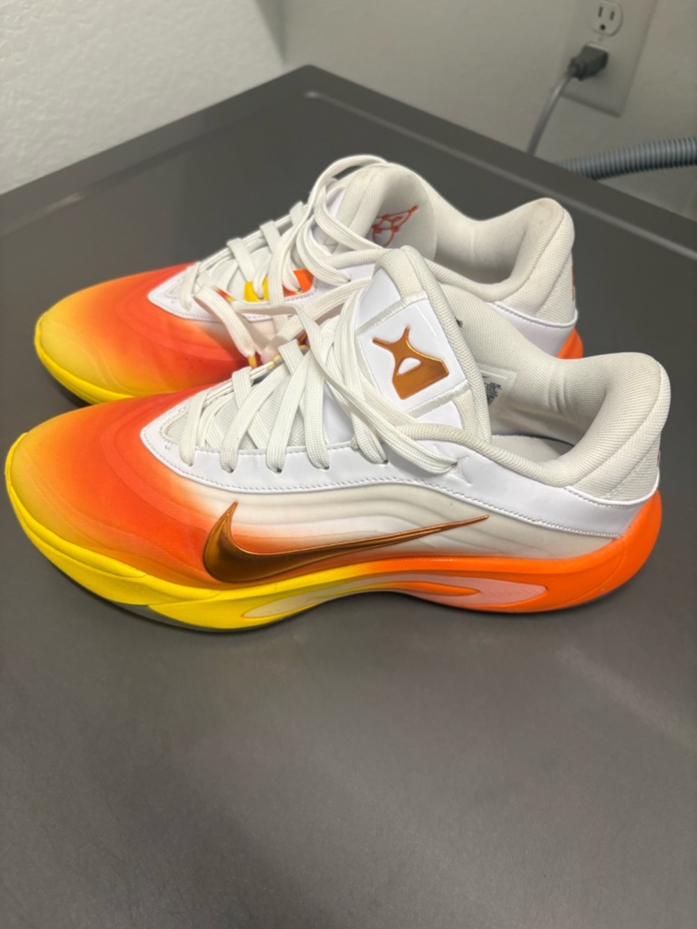 Nike White Low-Top Sneakers with Orange-Yellow Accent